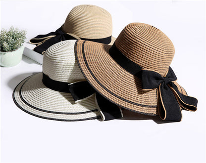 Elegante sombrero de sol de verano para mujer: detalle de lazo negro grande con paja plegable y ala ancha