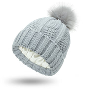 Stylish Satin-Lined Skull Knit Beanie with Faux Fur Pom Pom - Winter Warming Hat for Women